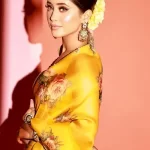 Indian actress Shivangi Joshi looks charming in a yellow Saree dress